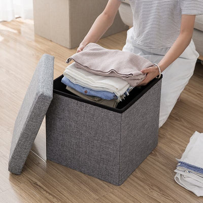 Tabouret de rangement pliable en tissu bleu, pratique et moderne

